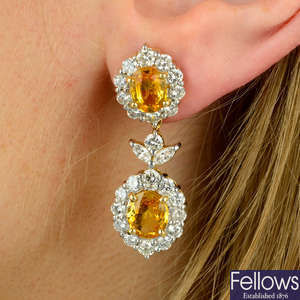 A pair of yellow sapphire and vari-cut diamond floral cluster drop earrings.