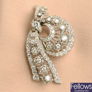 A mid 20th century circular-cut diamond floral clip brooch, by Cartier.
