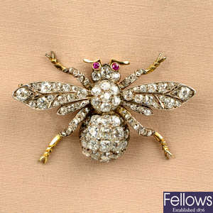 A late Victorian silver and gold, old-cut diamond bee brooch, with ruby eyes.