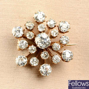 A late 19th to early 20th century gold old-cut diamond starburst brooch.