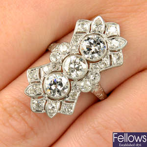 An Art Deco platinum old-cut diamond, pierced, geometric dress ring.