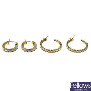 Two pairs of 9ct gold cubic zirconia hoop earrings.