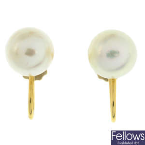 A pair of cultured pearl stud earrings.
