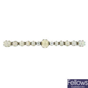 An early 20th century diamond and cultured pearl bar brooch.