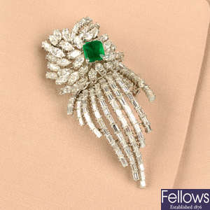 A mid 20th century platinum emerald and vari-cut diamond spray brooch.