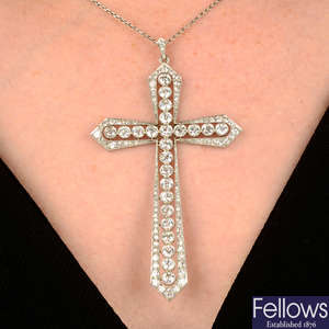 An early 20th century platinum old-cut diamond cross pendant, with chain.