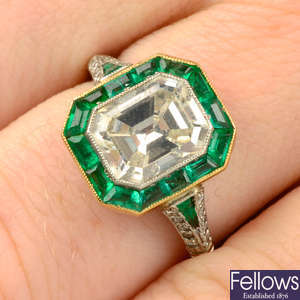 A rectangular-shape diamond and emerald cluster ring, with similarly-set shoulders.