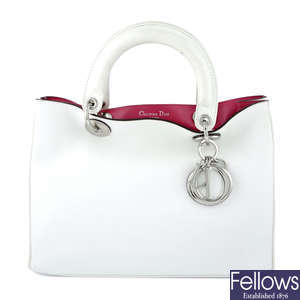 CHRISTIAN DIOR - a white leather Diorissimo handbag.