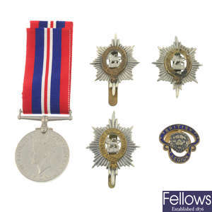 An assortment of medals, to include a WWII War Medal 1939-45, together with a selection of mixed coins.