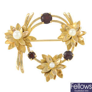A 9ct gold garnet and cultured pearl floral brooch.