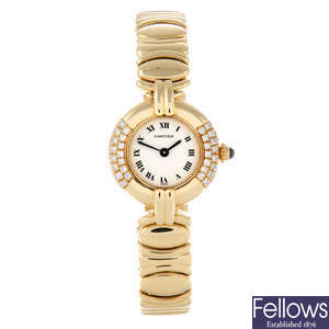 CARTIER - a lady's yellow metal Colisee bracelet watch.