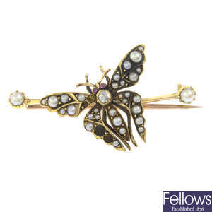 An early 20th century 18ct gold diamond, split pearl and ruby butterfly brooch.