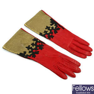 YVES SAINT LAURENT - a pair of red leather gloves.