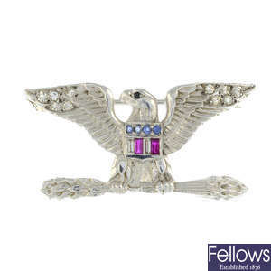 A sapphire, ruby and diamond American flag eagle brooch.