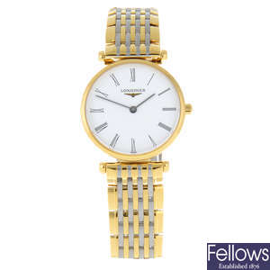 CURRENT MODEL: LONGINES - a lady's gold plated La Grande Classique bracelet watch.