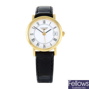 CURRENT MODEL: LONGINES - a lady's 18ct yellow gold Presence wrist watch.