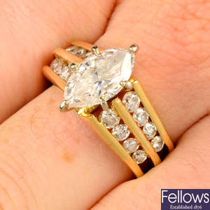 A marquise-shape diamond single-stone ring, with brilliant-cut diamond line shoulders.
