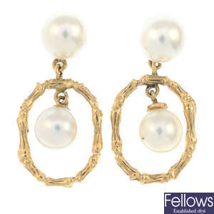 A pair of cultured pearl drop earrings.