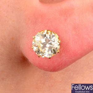 A pair of old-cut diamond stud earrings.