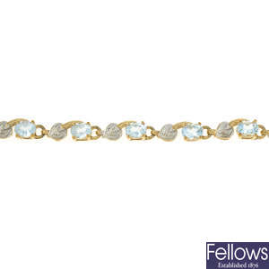 A 9ct gold diamond and topaz line bracelet.