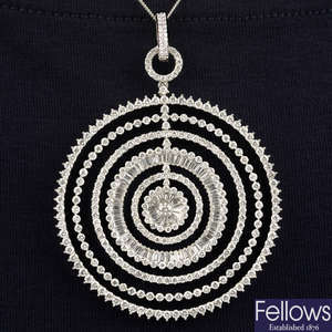 A brilliant and tapered baguette-cut diamond pendant.