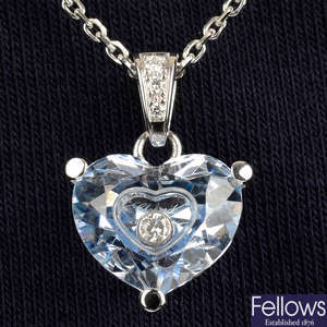 A blue topaz and diamond 'So Happy - Happy Diamonds' heart pendant, with chain.