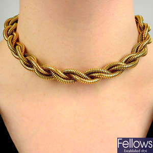 A 1940s 18ct gold bi-colour woven tubogas necklace.