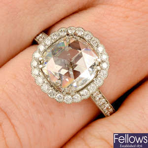A platinum rose-cut diamond and diamond cluster ring.