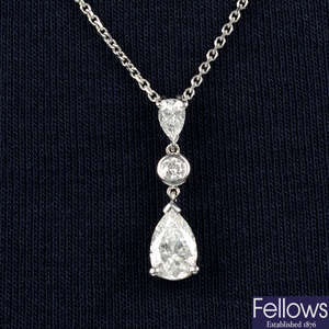 An 18ct gold graduated pear-shape and brilliant-cut diamond pendant, on chain.