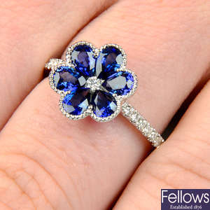 An 18ct gold sapphire and diamond floral ring.