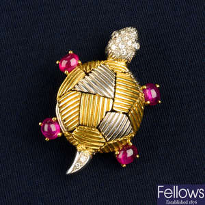 An Italian pavé-set diamond and ruby cabochon turtle brooch, by Marcello Duchi.