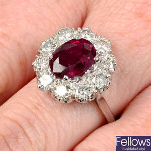 A ruby and brilliant-cut diamond cluster ring.
