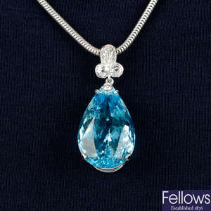An aquamarine and diamond pendant, with 18ct gold chain.