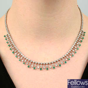 An 18ct gold emerald and diamond fringe necklace.