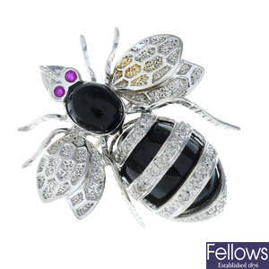 A pave-set diamond and gem-set bee brooch.