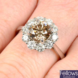 An 18ct gold 'brown' diamond and diamond cluster ring.