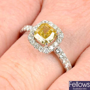 An 18ct gold 'yellow' diamond and diamond cluster ring.