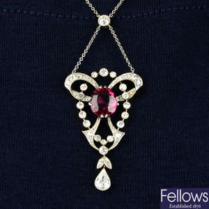 An early 20th century platinum and gold, garnet and diamond necklace.