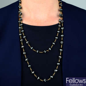 A late Victorian 9ct gold banded onyx chain necklace.