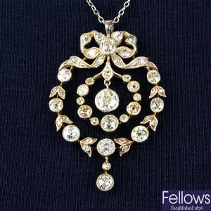 An early 20th century silver and gold old-cut diamond wreath pendant, with chain.