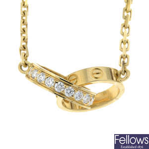 An 18ct gold brilliant-cut diamond 'Love' pendant, with integral chain, by Cartier.