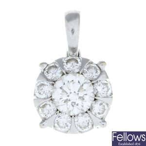 A brilliant-cut diamond cluster pendant, by Mappin & Webb.