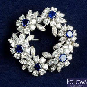 A mid 20th century 18ct gold sapphire and diamond floral wreath brooch.