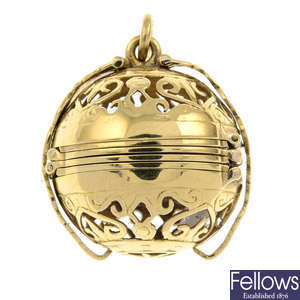 An openwork sphere locket pendant.