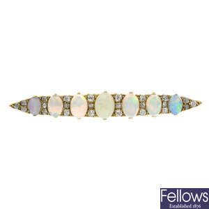 An early 20th century opal cabochon and old-cut diamond brooch.
