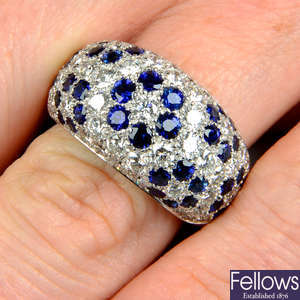 A pave-set diamond and sapphire floral bombe ring.