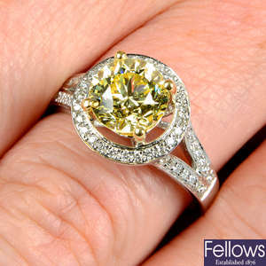 An 18ct gold brilliant-cut 'yellow' diamond and diamond ring.