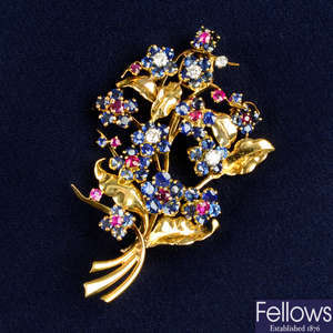 A mid 20th century 18ct gold sapphire, ruby and diamond floral brooch, by Mauboussin.