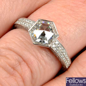 A platinum rose-cut diamond single-stone ring, with pavé-set diamond gallery and shoulders.