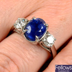 A platinum Kashmir sapphire and brilliant-cut diamond three-stone ring.